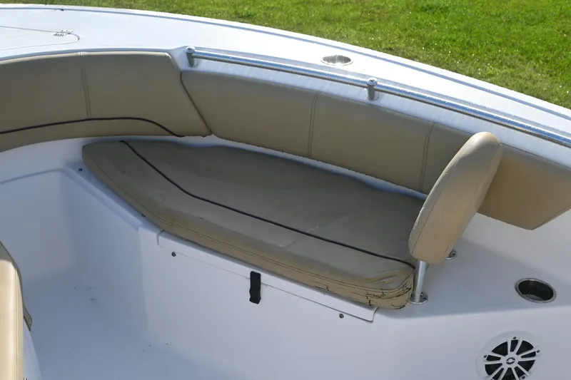 Slide: The Image of 2018 Sportsman Open 232 Center Console boat seating area with beige cushions. - 10