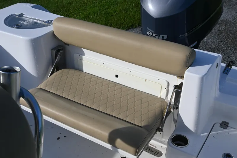 Slide: The Image of 2018 Sportsman Open 232 Center Console boat with beige seating and Yamaha engine. - 11