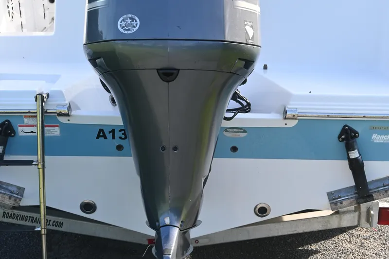 Slide: The Image of 2018 Sportsman Open 232 Center Console boat with outboard motor and trailer. - 4