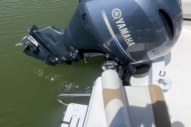 Slide: The Image of 2023 Edgewater 188CC boat with Yamaha outboard motor on water. - 11