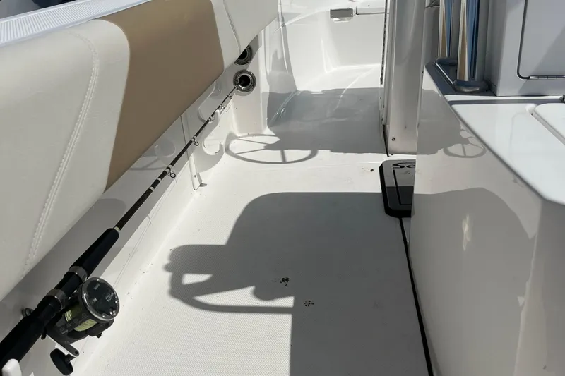 Slide: The Image of 2023 Edgewater 188CC boat interior with fishing rod holder and seating. - 7