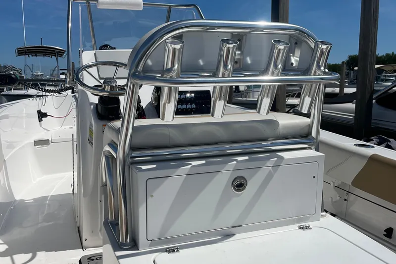 Slide: The Image of 2023 Edgewater 188CC boat interior with rod holders and steering console. - 9