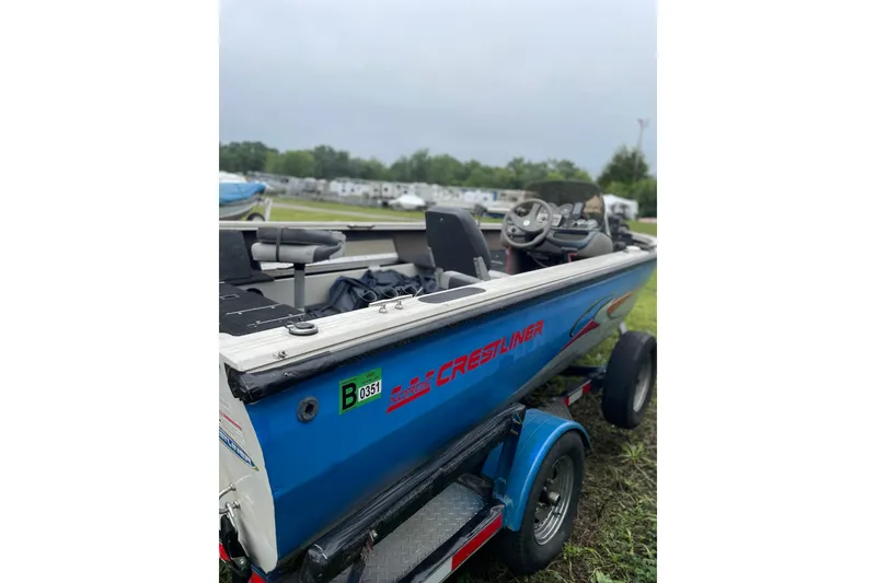 Slide: The Image of 2007 Crestliner Fish Hawk 1750 SC boat on trailer, parked outdoors. - 4