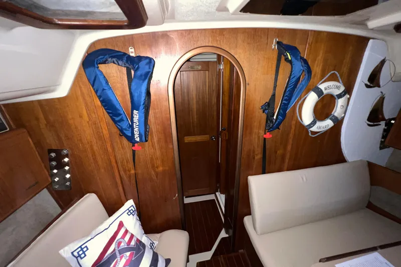 Slide: The Image of Interior of 1988 Hunter 333 sailboat with life jackets and nautical decor. - 9