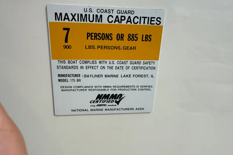 Slide: The Image of U.S. Coast Guard capacity label for 2012 Bayliner 175, 7 persons or 885 lbs. - 16