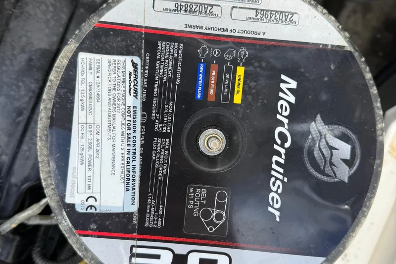 Slide: The Image of MerCruiser engine label on a 2012 Bayliner 175 boat, showing specifications and maintenance details. - 13