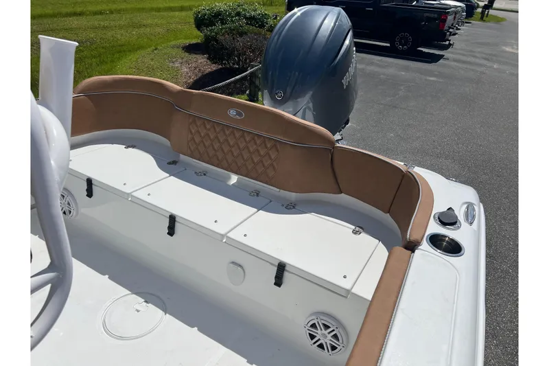 Slide: The Image of 2026 Sea Hunt Ultra 229 boat interior with tan seating and storage compartments. - 20