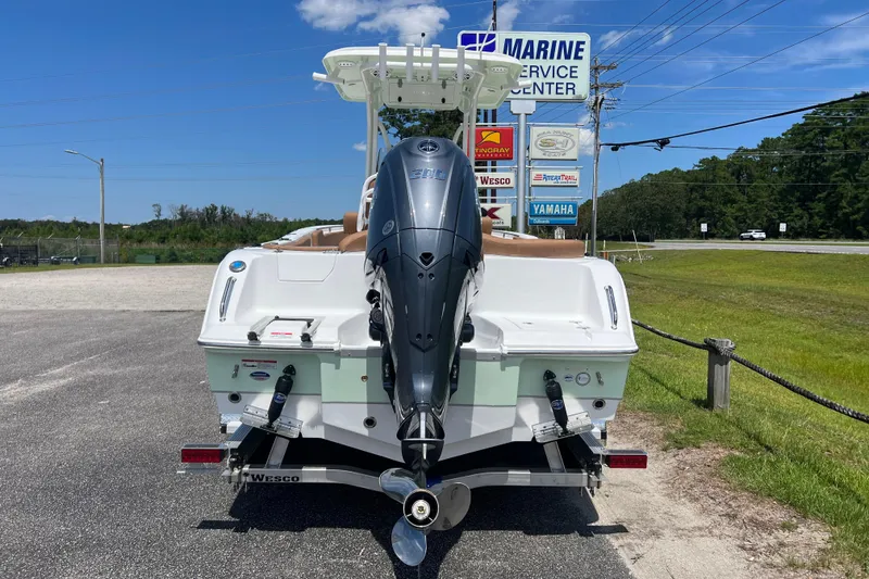 Slide: The Image of 2026 Sea Hunt Ultra 229 boat with outboard motor at marine service center. - 8