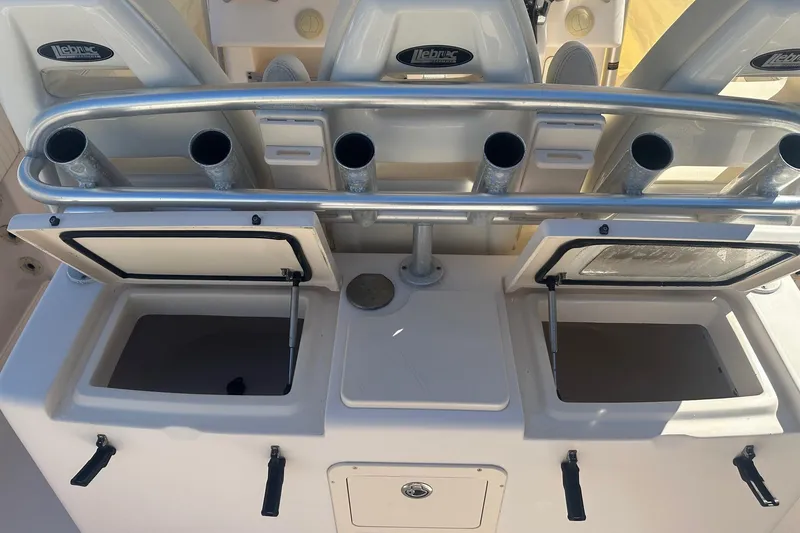 Slide: The Image of 2008 Grady-White Canyon 336 boat with open storage compartments and rod holders. - 10