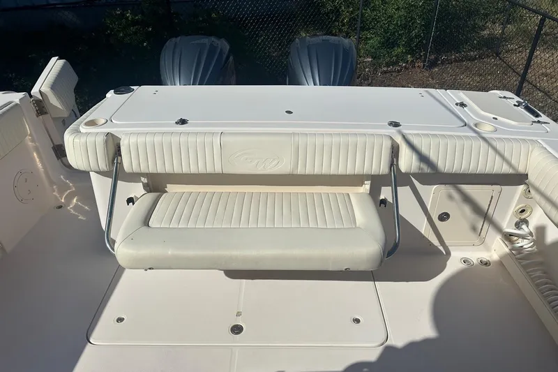Slide: The Image of 2008 Grady-White Canyon 336 boat interior with seating and storage compartments. - 12