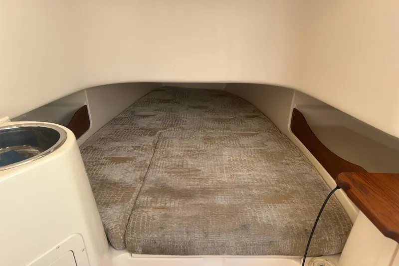 Slide: The Image of 2008 Grady-White Canyon 336 cabin interior with cushioned sleeping area. - 16