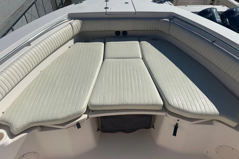 Slide: The Image of 2008 Grady-White Canyon 336 boat with spacious cushioned seating area. - 3