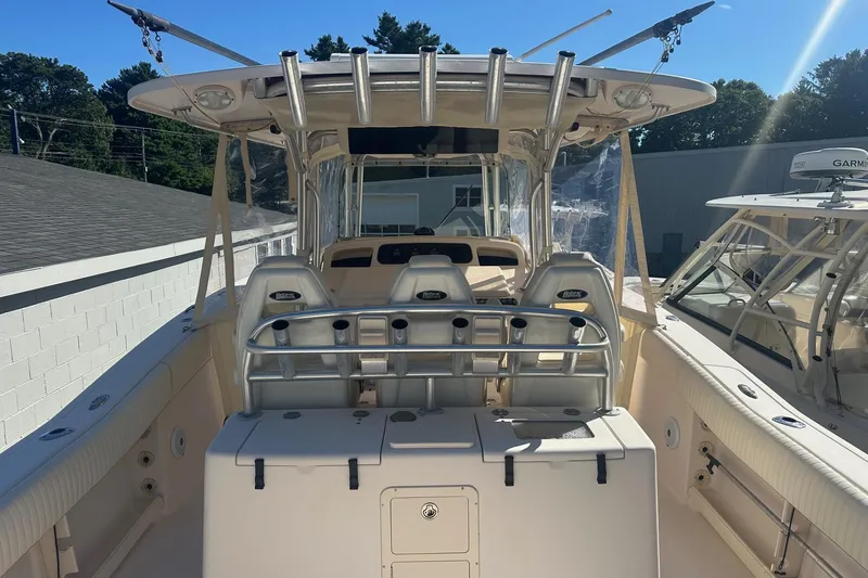 Slide: The Image of 2008 Grady-White Canyon 336 boat interior with seating and rod holders. - 5