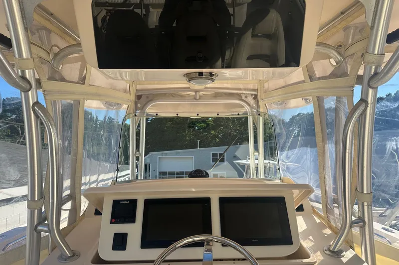Slide: The Image of 2008 Grady-White Canyon 336 boat helm with dual screens and protective enclosure. - 8
