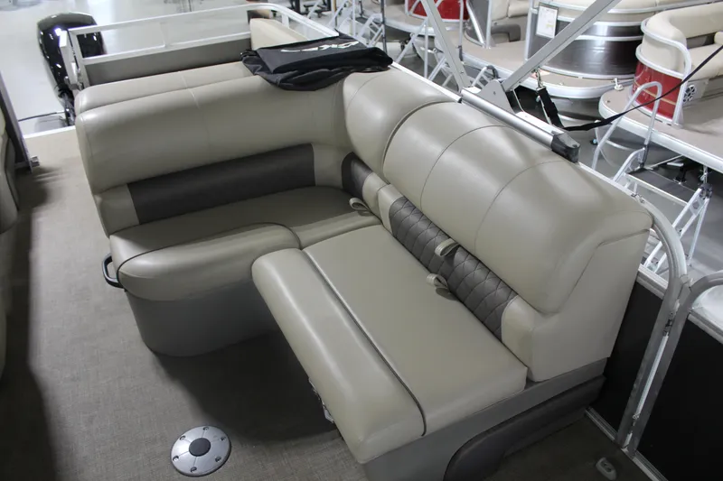 Slide: The Image of 2023 Sun Tracker Party Barge 22 RF DLX interior seating with beige upholstery. - 11