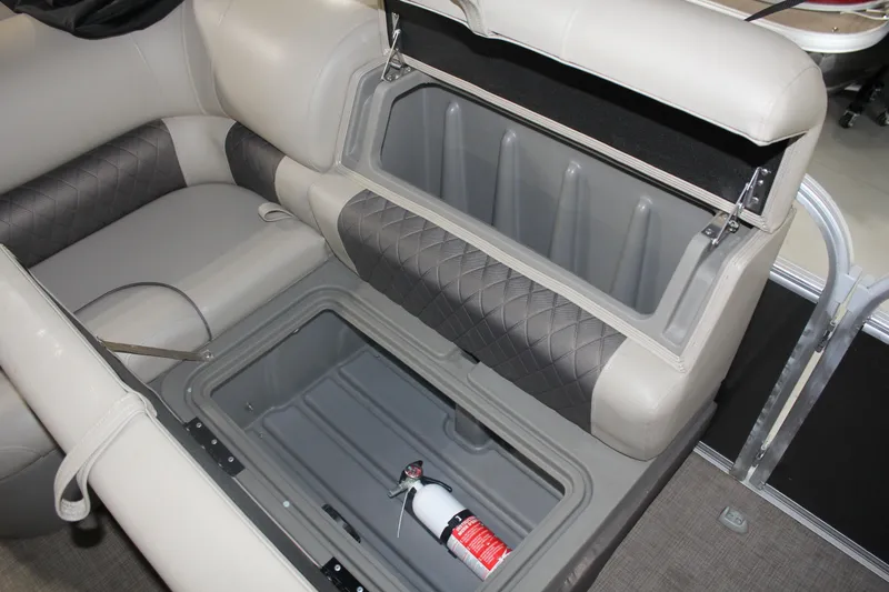Slide: The Image of 2023 Sun Tracker Party Barge 22 RF DLX storage compartment with fire extinguisher. - 12