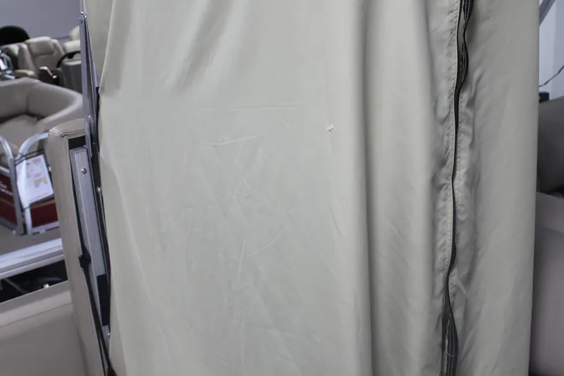 Slide: The Image of 2023 Sun Tracker Party Barge 22 RF DLX interior with protective cover. - 19