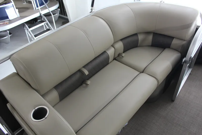 Slide: The Image of 2023 Sun Tracker Party Barge 22 RF DLX interior seating with cup holder. - 20