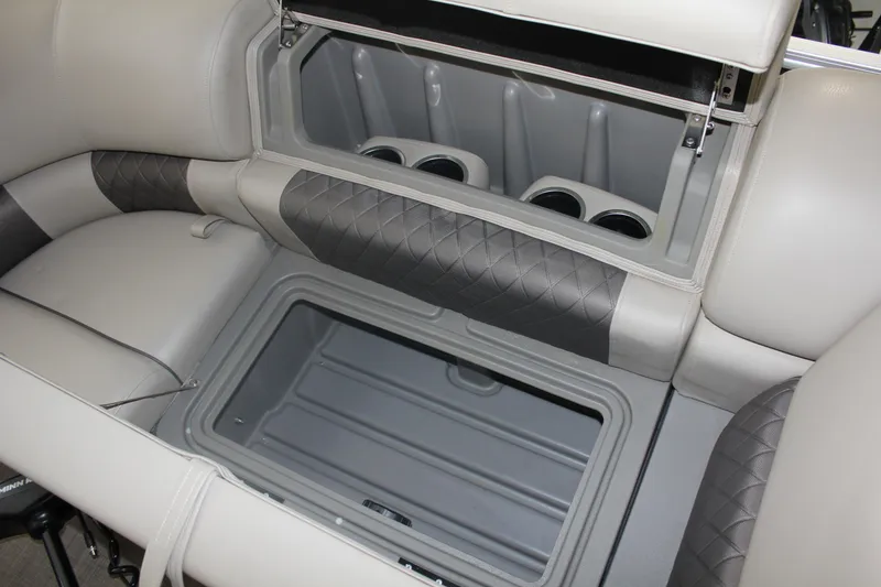 Slide: The Image of 2023 Sun Tracker Party Barge 22 RF DLX seating with integrated storage and cup holders. - 24