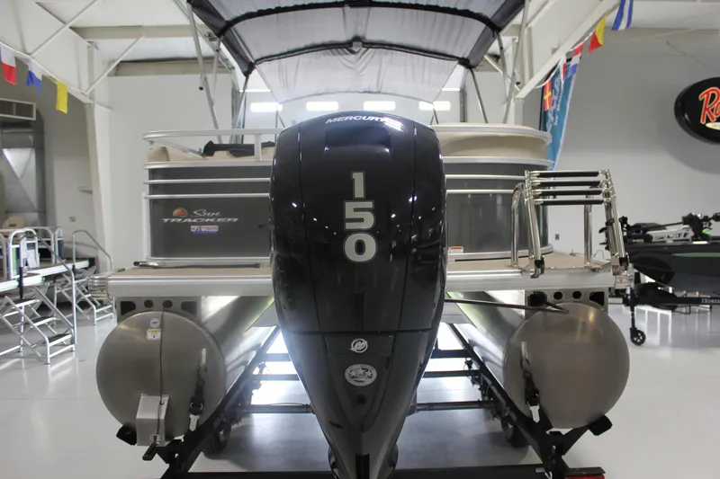 Slide: The Image of 2023 Sun Tracker Party Barge 22 RF DLX with Mercury 150 engine in showroom. - 26