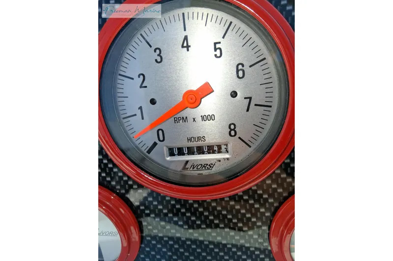 Slide: The Image of Tachometer of 2007 Baja 245 boat, displaying RPM and engine hours. - 11
