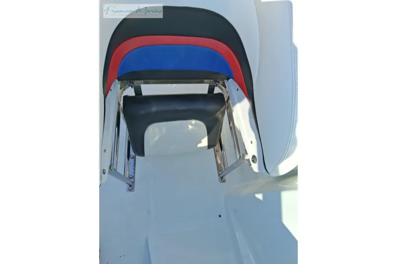 Slide: The Image of 2007 Baja 245 boat seat with colorful upholstery and chrome accents. - 18