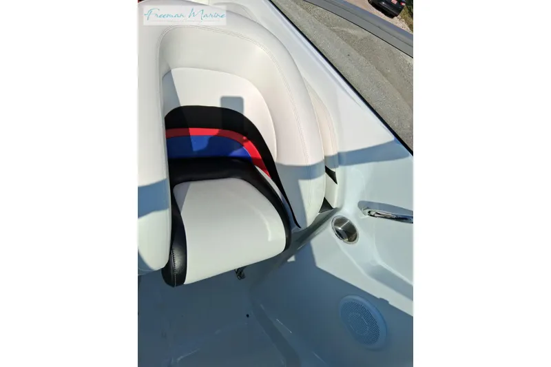 Slide: The Image of 2007 Baja 245 boat interior with white and black seating, featuring red and blue accents. - 23