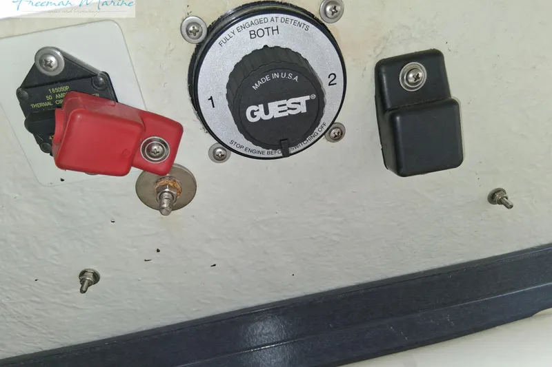 Slide: The Image of Control panel of a 2007 Baja 245 boat with switches and circuit breaker. - 34