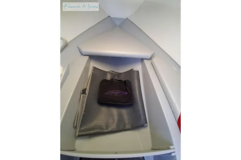 Slide: The Image of 2007 Baja 245 boat interior with storage compartment and accessories. - 35