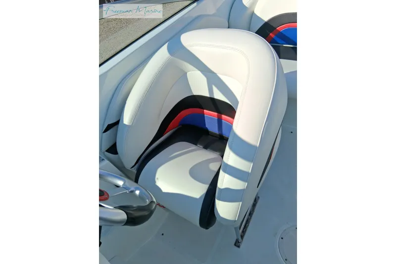 Slide: The Image of White and multicolored seat in 2007 Baja 245 boat interior. - 9