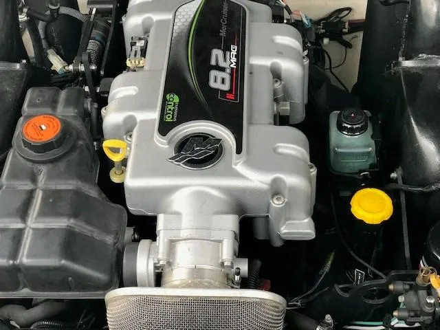 Slide: The Image of Engine of 2012 Sea Ray 280 Sundancer boat, featuring 8.2 MAG branding. - 14