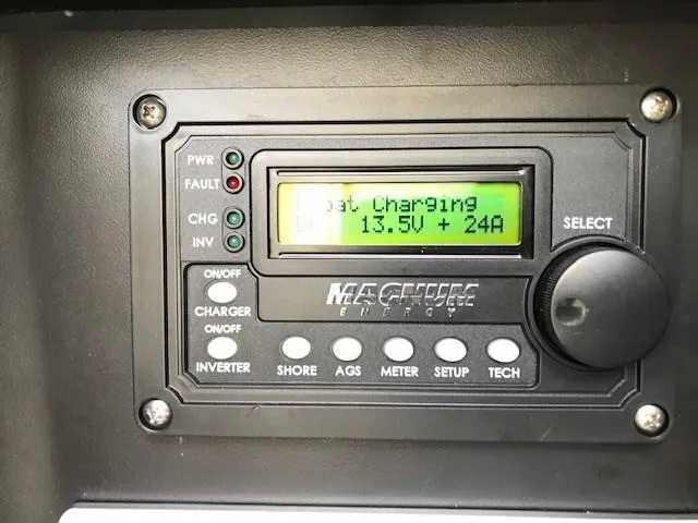Slide: The Image of Control panel of a 2012 Sea Ray 280 Sundancer, displaying battery charging status. - 17