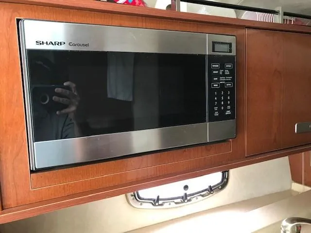 Slide: The Image of Sharp Carousel microwave in 2012 Sea Ray 280 Sundancer yacht kitchen. - 19