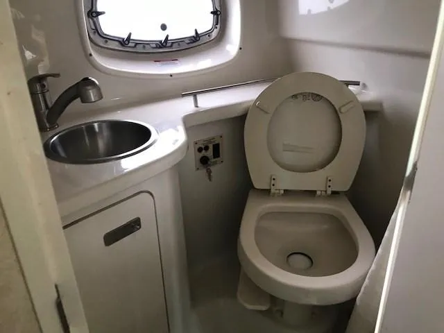Slide: The Image of 2012 Sea Ray 280 Sundancer bathroom with sink and toilet. - 24