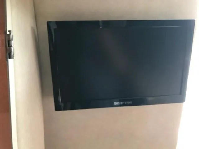 Slide: The Image of Wall-mounted Sceptre TV inside 2012 Sea Ray 280 Sundancer boat cabin. - 27