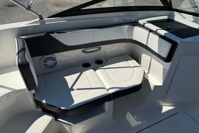 Slide: The Image of 2017 Sea Ray SPX 190 Outboard boat interior with cushioned seating and cup holders. - 3