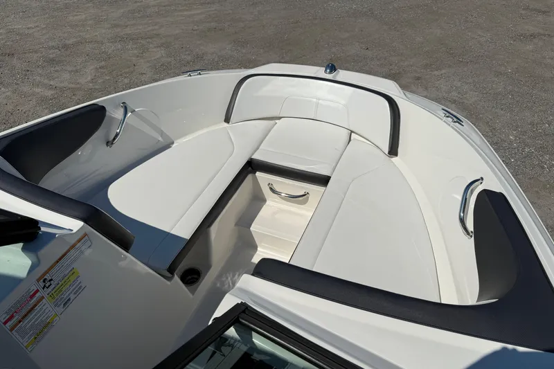 Slide: The Image of 2017 Sea Ray SPX 190 Outboard boat interior with white seating and stainless steel handles. - 7