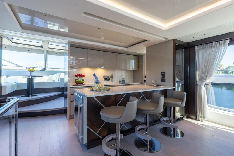 Slide: The Image of Luxurious interior of 2023 Sunseeker 90 Ocean yacht with modern kitchen and seating area. - 15