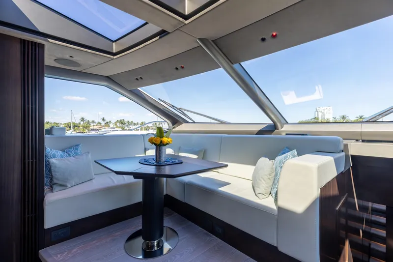 Slide: The Image of Luxurious interior of 2023 Sunseeker 90 Ocean yacht with elegant seating and panoramic windows. - 17