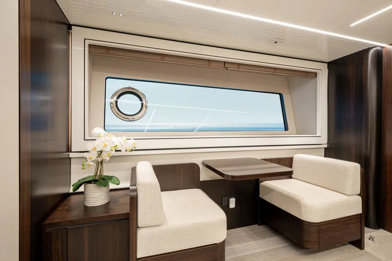Slide: The Image of Luxurious interior of 2023 Sunseeker 90 Ocean yacht with elegant seating and ocean view. - 24