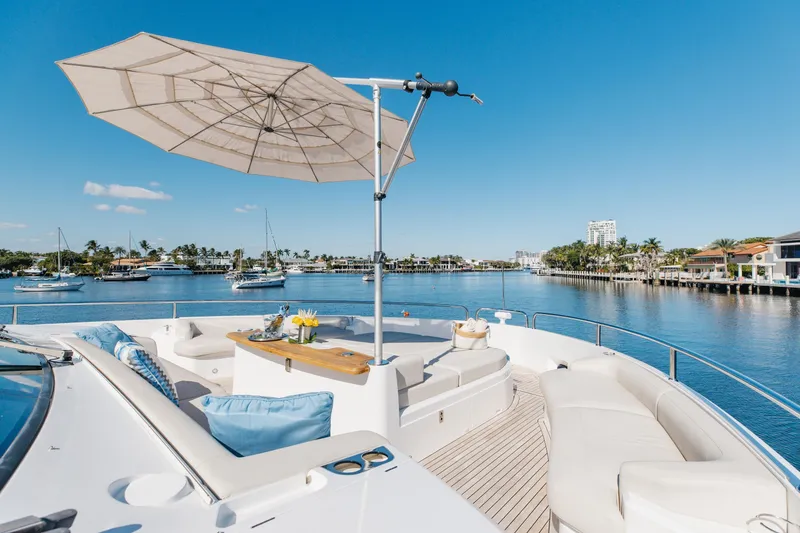 Slide: The Image of Luxurious Sunseeker 90 Ocean yacht deck with seating, umbrella, and waterfront view, 2023 model. - 43