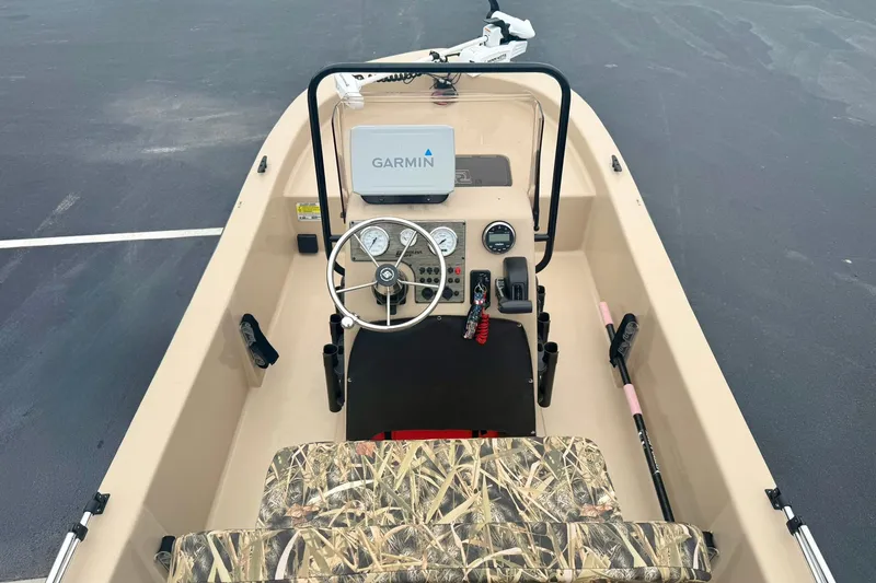 Slide: The Image of 2025 Carolina Skiff E18 JVX CC boat interior with Garmin navigation system. - 14