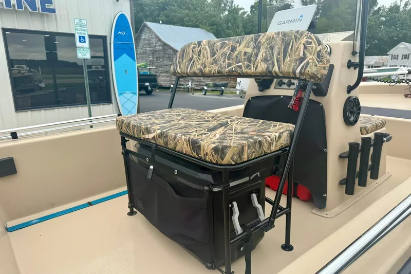 Slide: The Image of 2025 Carolina Skiff E18 JVX CC boat with camo seating and Garmin electronics. - 16