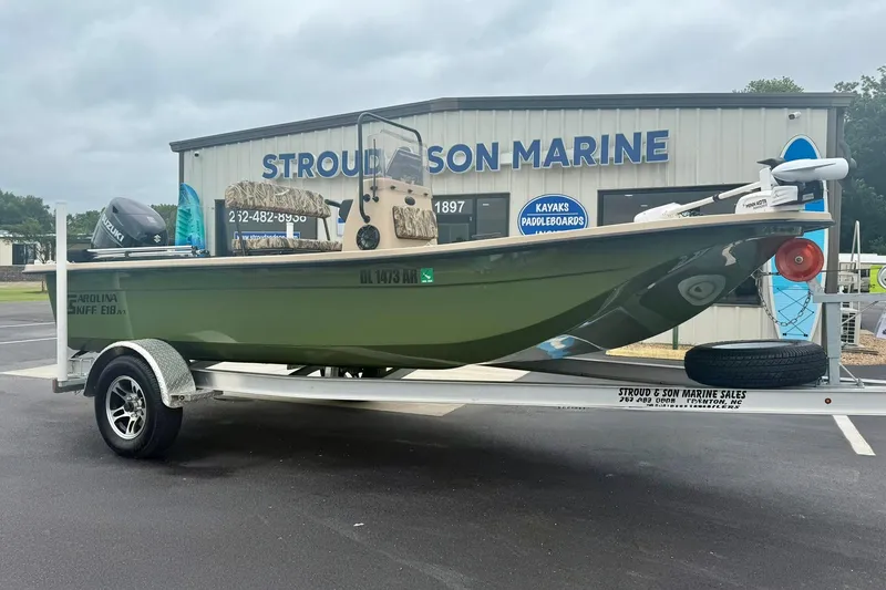 Slide: The Image of 2025 Carolina Skiff E18 JVX CC boat on trailer at Stroud & Son Marine. - 4