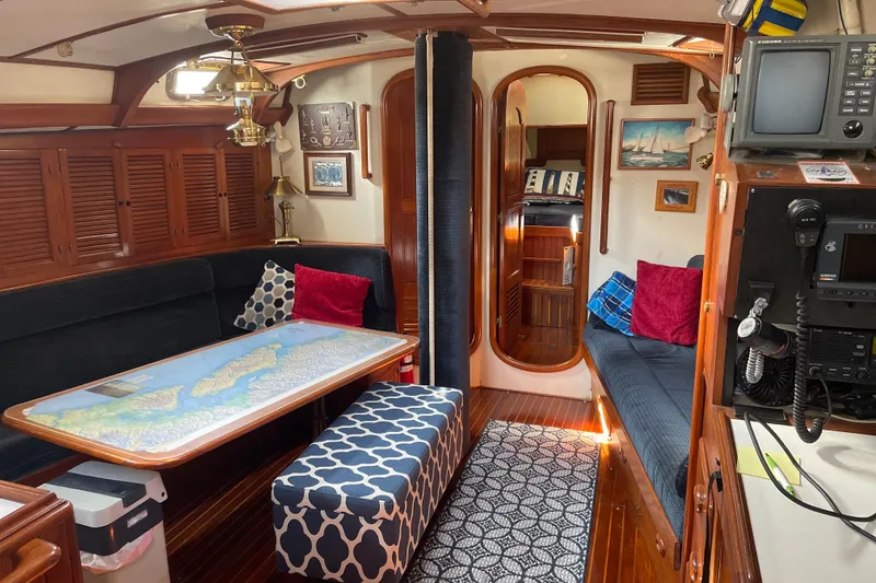 Slide: The Image of Interior of a 1981 Mariner 48 yacht with cozy seating and nautical decor. - 22