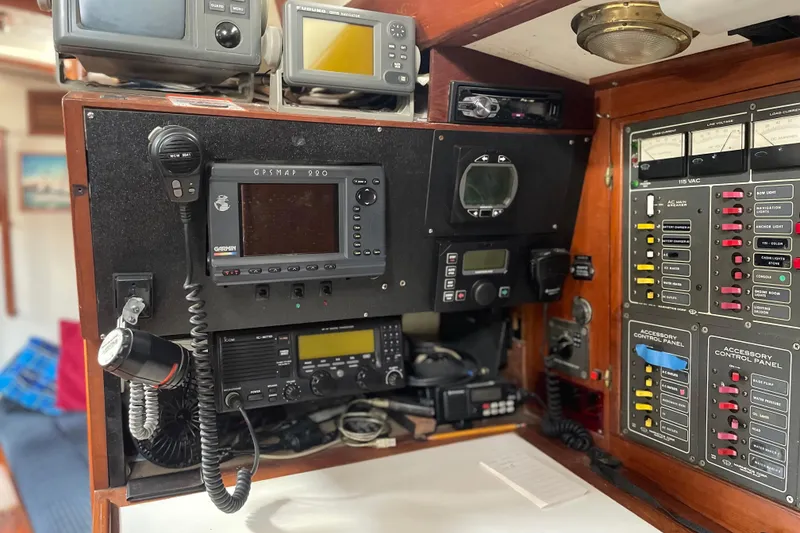 Slide: The Image of Control panel of a 1981 Mariner 48 yacht with navigation and communication equipment. - 33