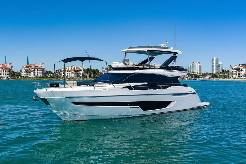 The Image of Luxury 2021 Fairline Squadron 68 yacht cruising in scenic coastal waters. - 0