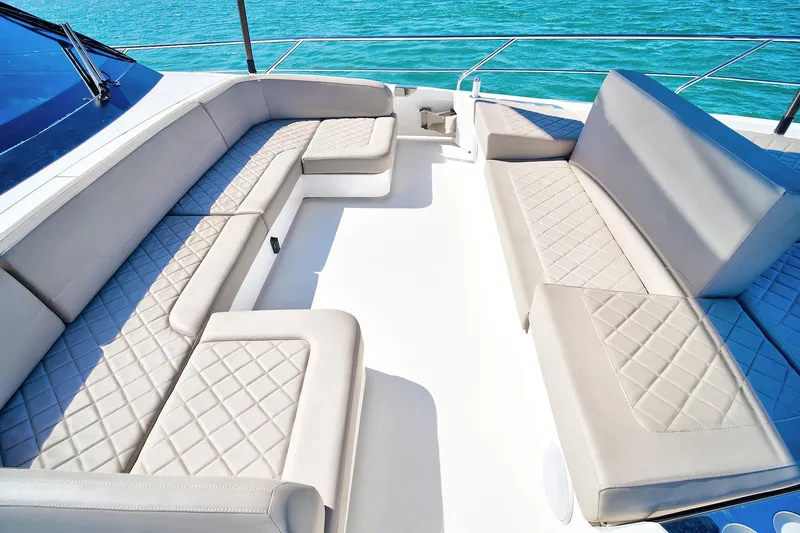 Slide: The Image of Luxurious seating area on 2021 Fairline Squadron 68 yacht, featuring elegant quilted upholstery. - 13