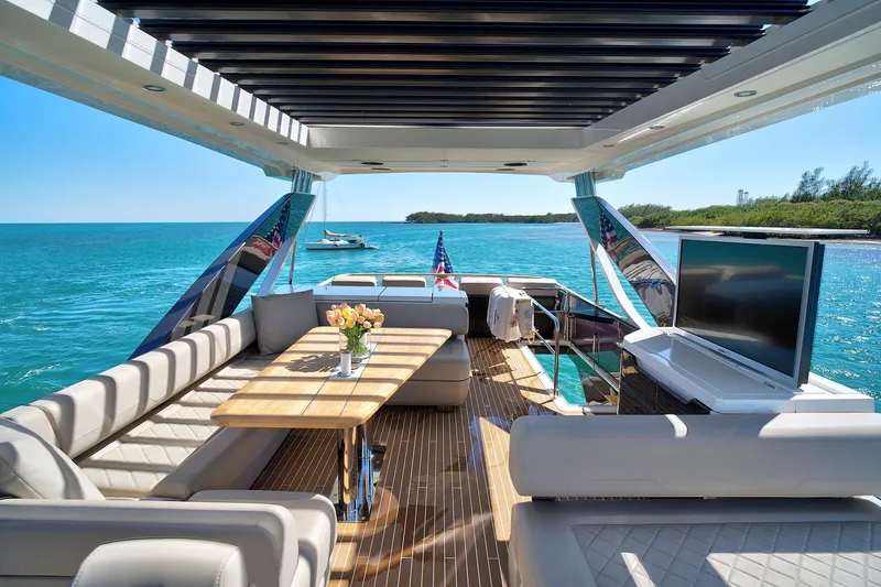 Slide: The Image of Luxurious 2021 Fairline Squadron 68 yacht interior with ocean view and elegant seating area. - 14