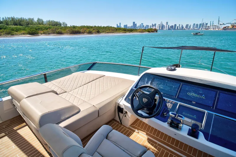 Slide: The Image of Luxurious 2021 Fairline Squadron 68 yacht interior with stunning ocean view and modern navigation system. - 17